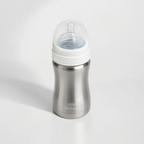 A stainless steel baby bottle with a white collar and a clear silicone nipple, branded 'little steelware' on the front, set against a clean white background.