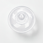 A clear plastic breast flange shown from a top-down view on a clean white background.