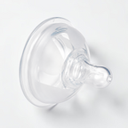 A clear silicone baby bottle nipple, photographed on a clean white background.