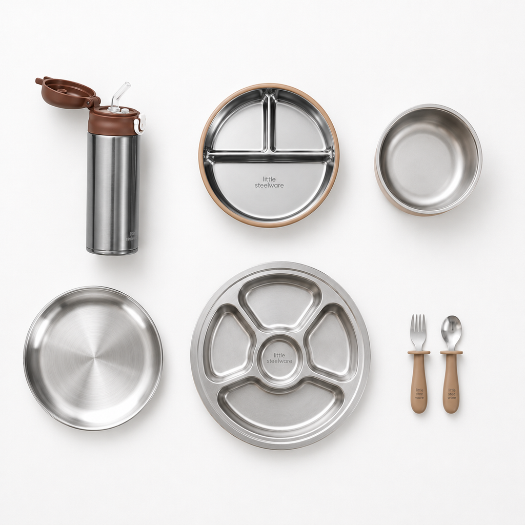 A flat-lay view of a stainless steel lunch set on a white background, including a water bottle, divided plates, a bowl, utensils, and small wooden-handled tools. The brand name 'little stonewall' is visible on the plate.